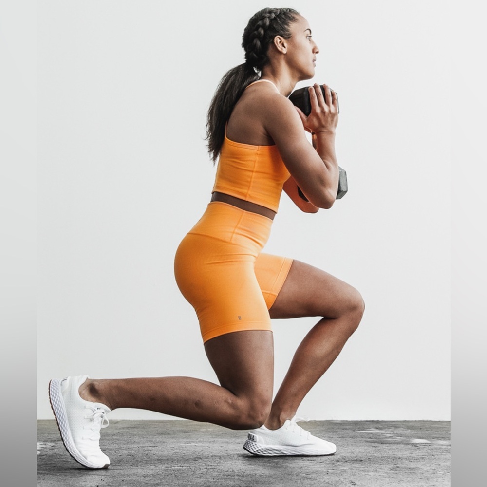 NOBULL Women's High Rise Neon Orange 6” Inseam Ribbed Shorts